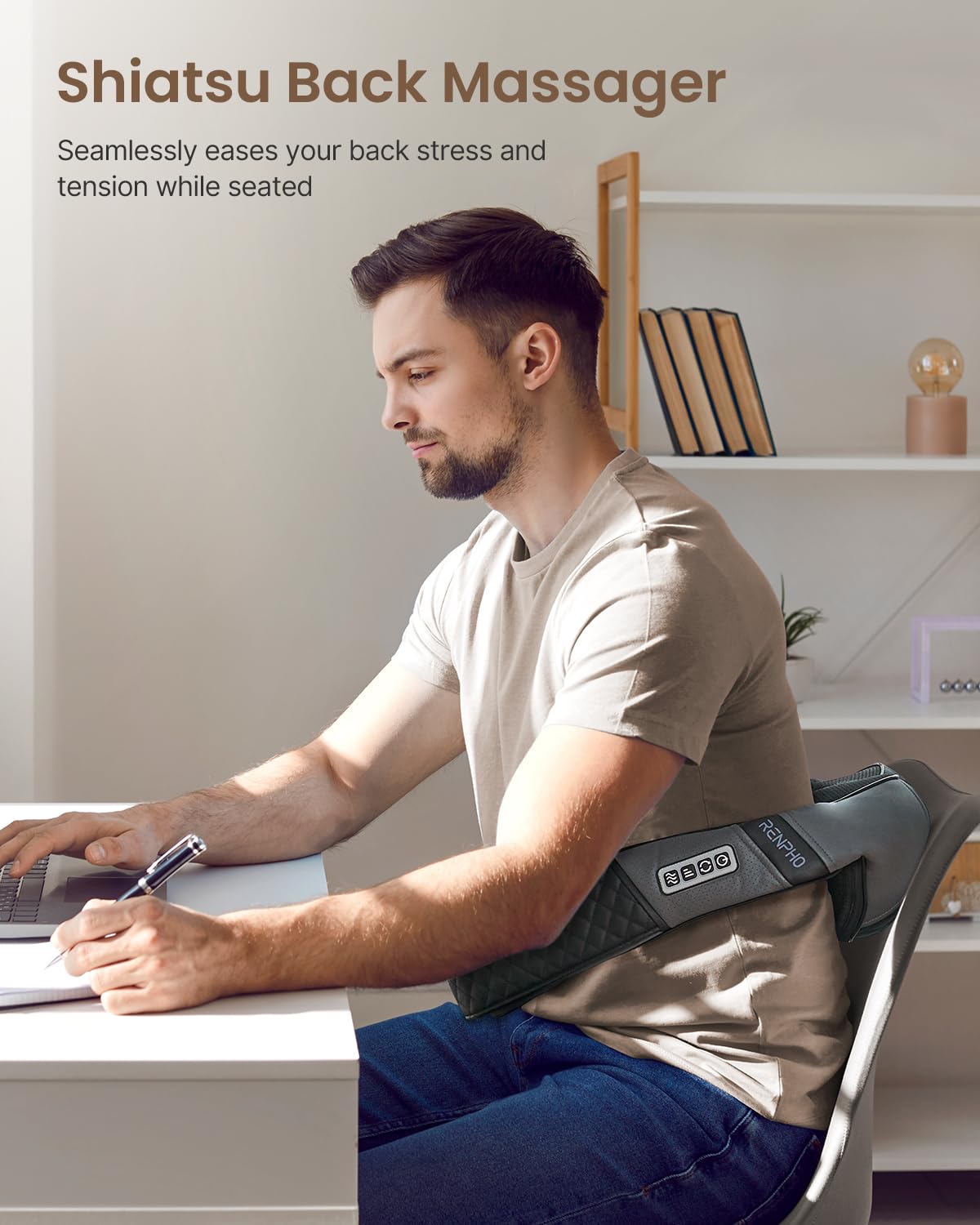 Man using a U-Neck 2 Neck & Shoulders Massager while working on a computer in a serene home office setting.